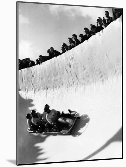 Good of Cresta Run, Bobsled Run, Coasting around Sunny Bend as People Peer from Above the Track-Alfred Eisenstaedt-Mounted Photographic Print