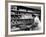 Good of Worker in Bakery Standing in Front of Shelves of Various Kinds of Breads and Rolls-Alfred Eisenstaedt-Framed Photographic Print