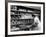 Good of Worker in Bakery Standing in Front of Shelves of Various Kinds of Breads and Rolls-Alfred Eisenstaedt-Framed Photographic Print