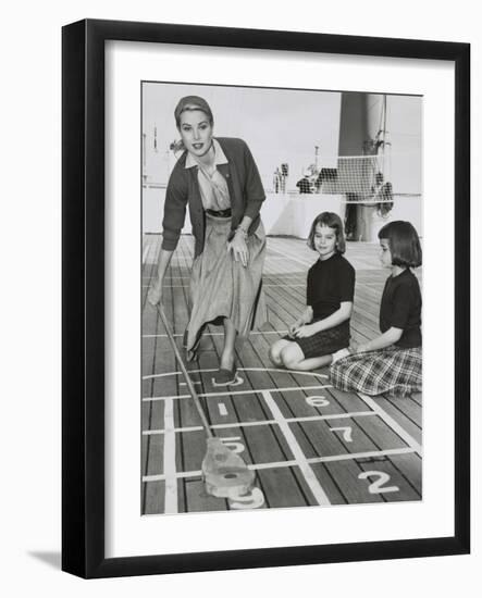 Grace Kelly by Playing Shuffleboard on the Deck of the Uss Constitution, April 10, 1956-null-Framed Premium Photographic Print