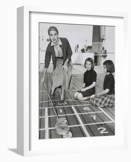 Grace Kelly by Playing Shuffleboard on the Deck of the Uss Constitution, April 10, 1956-null-Framed Premium Photographic Print