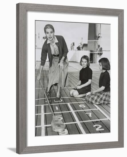 Grace Kelly by Playing Shuffleboard on the Deck of the Uss Constitution, April 10, 1956-null-Framed Photo