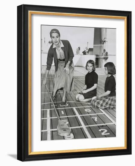 Grace Kelly by Playing Shuffleboard on the Deck of the Uss Constitution, April 10, 1956-null-Framed Photo