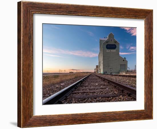 Grain elevator and railroad track, Milk River, Alberta, Canada-null-Framed Photographic Print