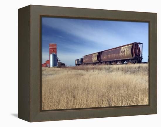 Grain Elevators and Wheat Train, Saskatchewan, Canada-Walter Bibikow-Framed Premier Image Canvas