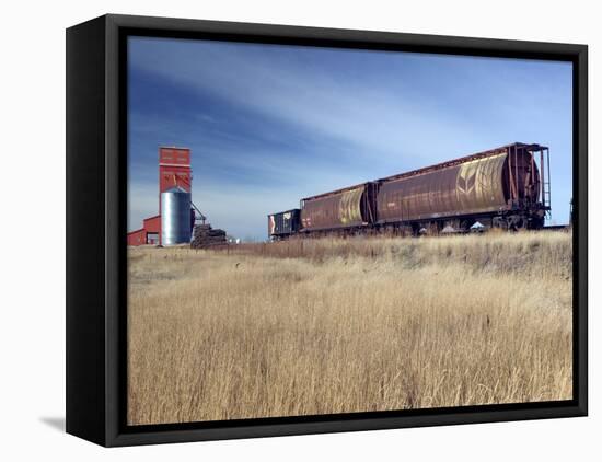Grain Elevators and Wheat Train, Saskatchewan, Canada-Walter Bibikow-Framed Premier Image Canvas