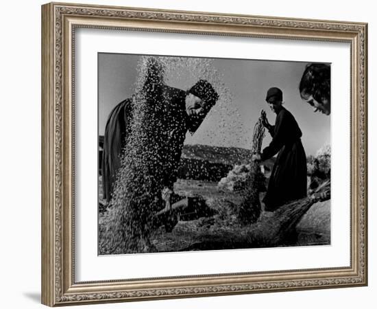Grain Flying in Air During Winnowing by Women in Famous Spanish Village-W^ Eugene Smith-Framed Photographic Print