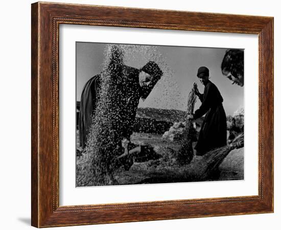 Grain Flying in Air During Winnowing by Women in Famous Spanish Village-W^ Eugene Smith-Framed Photographic Print