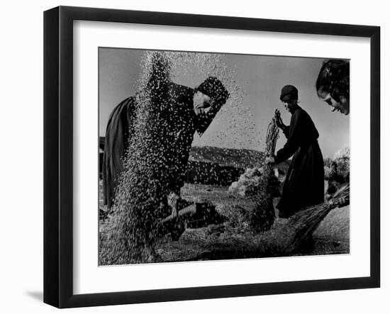 Grain Flying in Air During Winnowing by Women in Famous Spanish Village-W^ Eugene Smith-Framed Photographic Print