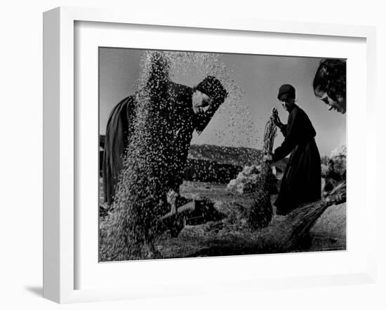 Grain Flying in Air During Winnowing by Women in Famous Spanish Village-W^ Eugene Smith-Framed Photographic Print