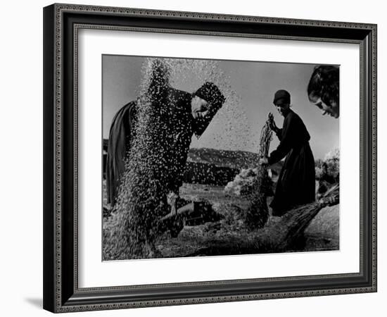 Grain Flying in Air During Winnowing by Women in Famous Spanish Village-W^ Eugene Smith-Framed Photographic Print