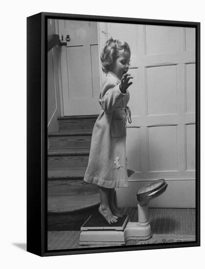 Grand Daughter of Winston Churchill, Arabella Spencer Churchill, Jouncing on Bathroom Scale-Carl Mydans-Framed Premier Image Canvas