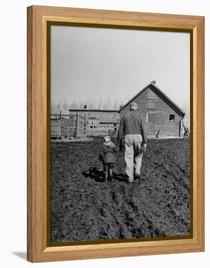 Grandpa and 4 Year Old Granddaughter, on Morning Chores, to Feed Pigs on Nearby Lot-Gordon Parks-Framed Premier Image Canvas