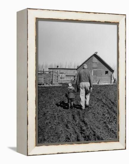 Grandpa and 4 Year Old Granddaughter, on Morning Chores, to Feed Pigs on Nearby Lot-Gordon Parks-Framed Premier Image Canvas