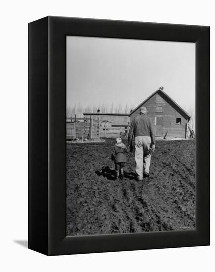 Grandpa and 4 Year Old Granddaughter, on Morning Chores, to Feed Pigs on Nearby Lot-Gordon Parks-Framed Premier Image Canvas