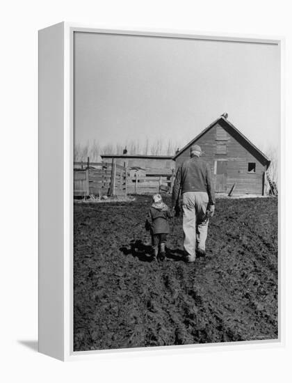 Grandpa and 4 Year Old Granddaughter, on Morning Chores, to Feed Pigs on Nearby Lot-Gordon Parks-Framed Premier Image Canvas