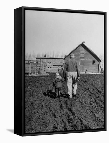 Grandpa and 4 Year Old Granddaughter, on Morning Chores, to Feed Pigs on Nearby Lot-Gordon Parks-Framed Premier Image Canvas