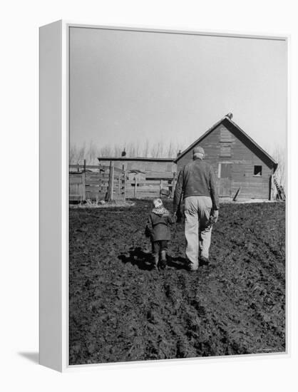 Grandpa and 4 Year Old Granddaughter, on Morning Chores, to Feed Pigs on Nearby Lot-Gordon Parks-Framed Premier Image Canvas