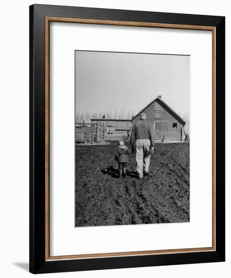 Grandpa and 4 Year Old Granddaughter, on Morning Chores, to Feed Pigs on Nearby Lot-Gordon Parks-Framed Premium Photographic Print