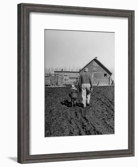 Grandpa and 4 Year Old Granddaughter, on Morning Chores, to Feed Pigs on Nearby Lot-Gordon Parks-Framed Premium Photographic Print