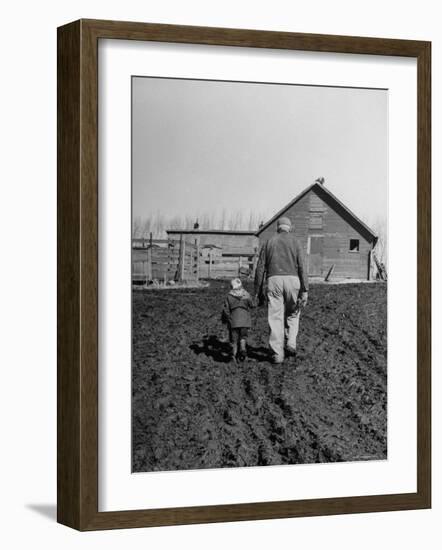 Grandpa and 4 Year Old Granddaughter, on Morning Chores, to Feed Pigs on Nearby Lot-Gordon Parks-Framed Photographic Print