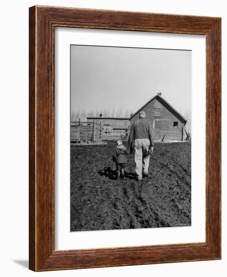 Grandpa and 4 Year Old Granddaughter, on Morning Chores, to Feed Pigs on Nearby Lot-Gordon Parks-Framed Photographic Print