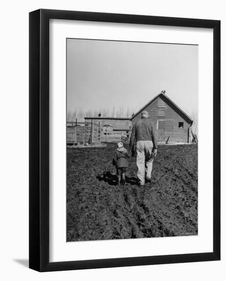 Grandpa and 4 Year Old Granddaughter, on Morning Chores, to Feed Pigs on Nearby Lot-Gordon Parks-Framed Photographic Print