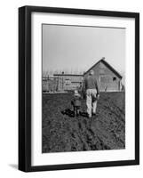 Grandpa and 4 Year Old Granddaughter, on Morning Chores, to Feed Pigs on Nearby Lot-Gordon Parks-Framed Photographic Print