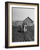 Grandpa and 4 Year Old Granddaughter, on Morning Chores, to Feed Pigs on Nearby Lot-Gordon Parks-Framed Photographic Print