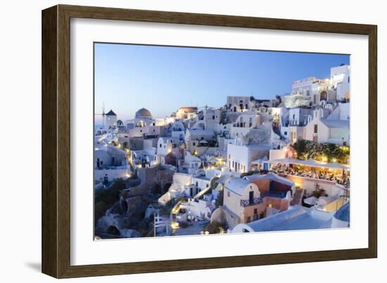 Greece, Santorini, Oia. white buildings and steep mountains at sunset.-Bill Bachmann-Framed Photographic Print