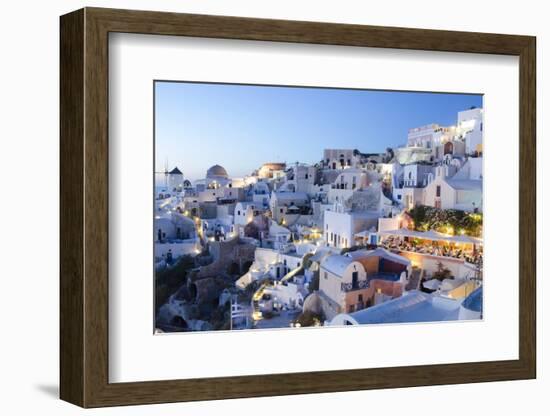 Greece, Santorini, Oia. white buildings and steep mountains at sunset.-Bill Bachmann-Framed Photographic Print