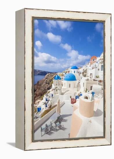 Greek Church with Three Blue Domes in the Village of Oia-Neale Clark-Framed Premier Image Canvas