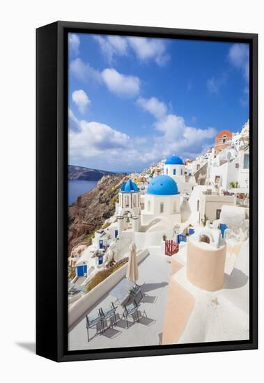 Greek Church with Three Blue Domes in the Village of Oia-Neale Clark-Framed Premier Image Canvas