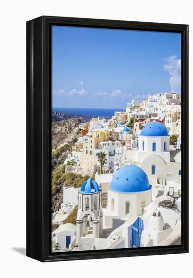 Greek Church with Three Blue Domes in the Village of Oia-Neale Clark-Framed Premier Image Canvas