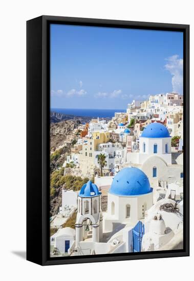 Greek Church with Three Blue Domes in the Village of Oia-Neale Clark-Framed Premier Image Canvas