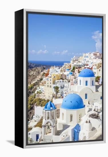 Greek Church with Three Blue Domes in the Village of Oia-Neale Clark-Framed Premier Image Canvas