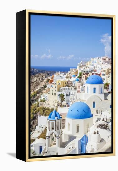 Greek Church with Three Blue Domes in the Village of Oia-Neale Clark-Framed Premier Image Canvas