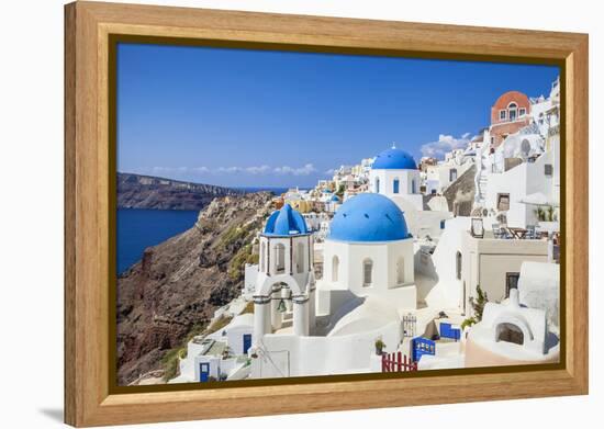 Greek Church with Three Blue Domes in the Village of Oia-Neale Clark-Framed Premier Image Canvas