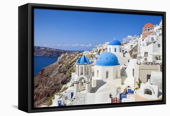 Greek Church with Three Blue Domes in the Village of Oia-Neale Clark-Framed Premier Image Canvas