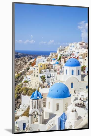 Greek Church with Three Blue Domes in the Village of Oia-Neale Clark-Mounted Photographic Print