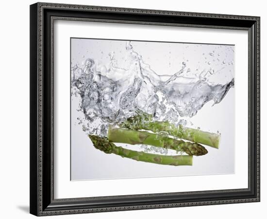 Green Asparagus Falling into Water-Kröger & Gross-Framed Photographic Print