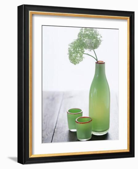 Green Bottle with Flowers and Green Glasses-Alena Hrbkova-Framed Premium Photographic Print