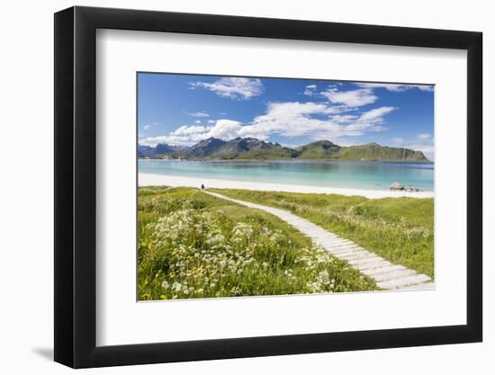 Green meadows and flowers surrounded by turquoise sea and fine sand, Ramberg, Lofoten Islands, Norw-Roberto Moiola-Framed Photographic Print