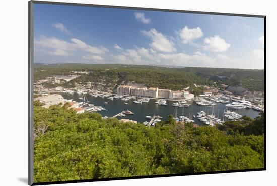 Green vegetation frames the medieval town and harbour, Bonifacio, Corsica, France, Mediterranean, E-Roberto Moiola-Mounted Photographic Print