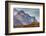 Greenland. Kong Oscar Fjord. Ella Island. Hiker dwarfed by rocky mountains.-Inger Hogstrom-Framed Photographic Print