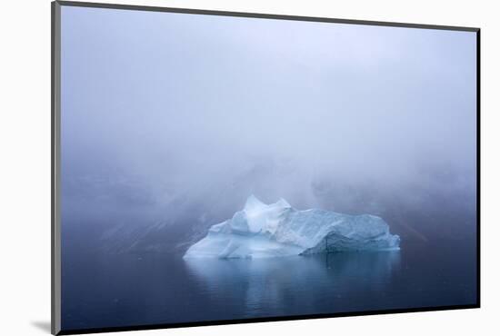 Greenland. Northeast Greenland National Park. Kong Oscar Fjord. Iceberg in dense fog.-Inger Hogstrom-Mounted Photographic Print