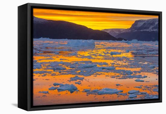 Greenland. Scoresby Sund. Gasefjord. Sunset with icebergs and brash ice.-Inger Hogstrom-Framed Premier Image Canvas