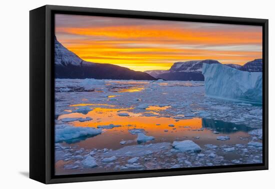 Greenland, Scoresby Sund, Gasefjord. Sunset with icebergs and brash ice.-Inger Hogstrom-Framed Premier Image Canvas