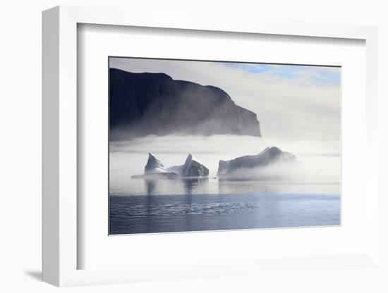 Greenland, Uummannaq. Morning fog envelopes Icebergs Uummannaq Fjord Bay-Miva Stock-Framed Photographic Print