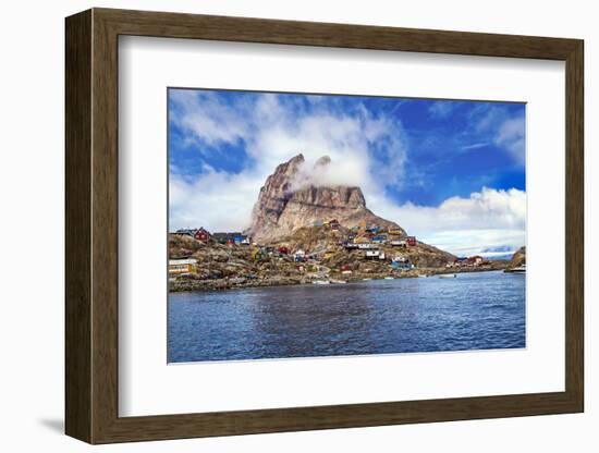 Greenland, Uummannaq. Uummannaq mountain (1170 m, 3839 ft) looms over the fishing village of Uumman-Miva Stock-Framed Photographic Print